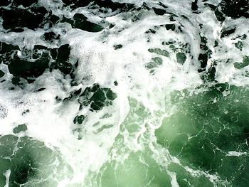 High angle view of water flowing through rocks