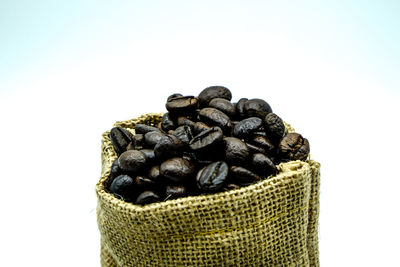 Close-up of coffee beans against white background