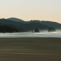 Scenic view of sea against clear sky during sunset