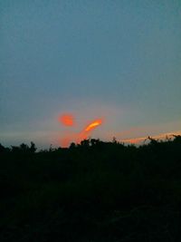 Silhouette landscape against sky during sunset