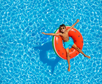 High angle view of woman swimming in pool