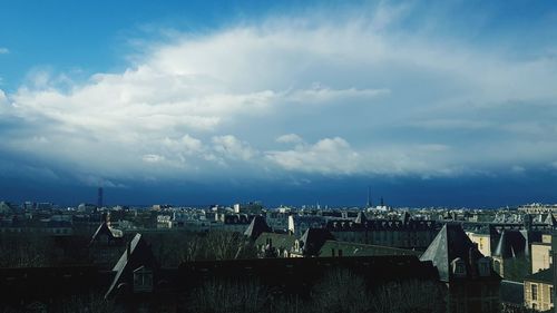 High angle view of city against cloudy sky