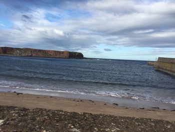 Scenic view of beach against sky