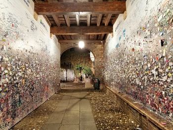 People walking in illuminated tunnel