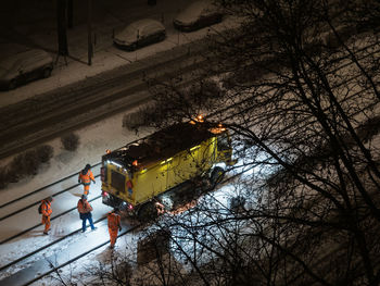 High angle view of snow covered trees at night