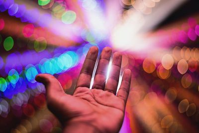 Close-up of hand holding illuminated lights