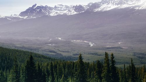 Scenic view of mountains against cloudy sky