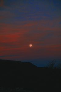 Scenic view of silhouette landscape against romantic sky at sunset