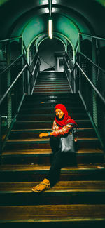 Portrait of woman on staircase