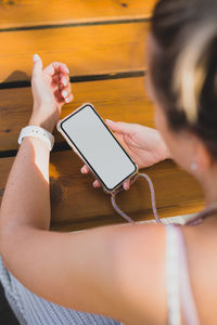 Midsection of woman using mobile phone