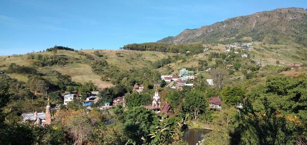 High angle view of trees and houses against sky