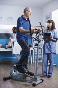 Side view of man exercising in gym