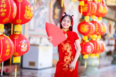 Rear view of woman with red lanterns