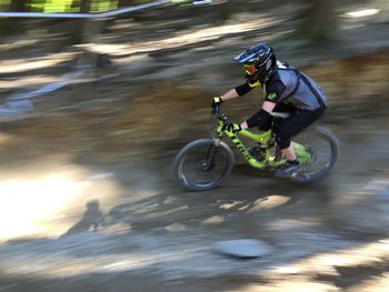 Blurred motion of man riding bicycle
