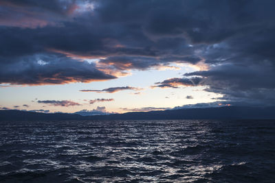 Scenic view of sea against sky at sunset