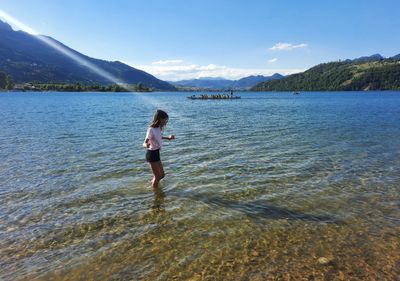 Young girl working in the lake