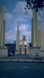 View of buildings against cloudy sky