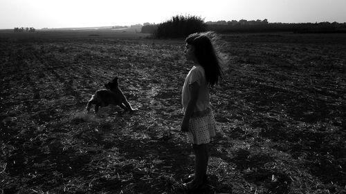 Rear view of woman on field