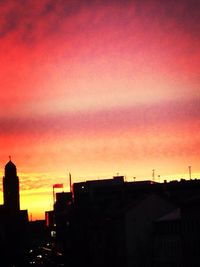 Low angle view of building against sky at sunset