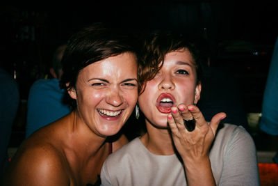 Portrait of happy women in darkroom