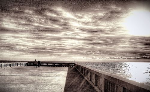 Scenic view of sea against cloudy sky