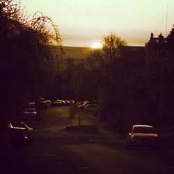 Car on road at sunset