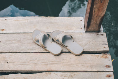 High angle view of shoes on wooden table