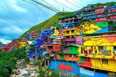 Low angle view of multi colored buildings against sky