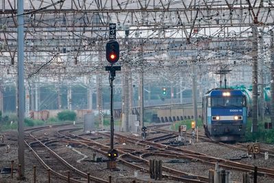 Train on railroad tracks in city