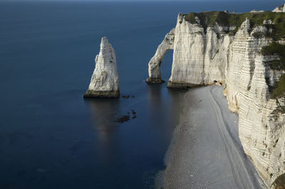 Panoramic view of sea and rock formations against sky