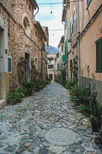Narrow street amidst buildings in town
