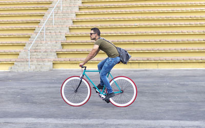 Low section of man riding bicycle