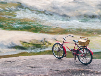 Bicycle leaning against rocks