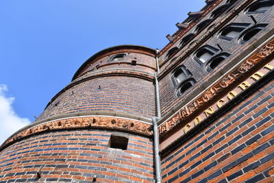 Low angle view of building against blue sky