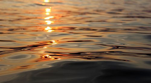 High angle view of rippled water at sunset