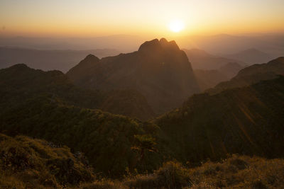 Scenic view of mountains against sky during sunset