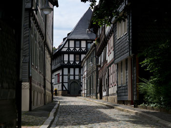 Narrow street amidst buildings in town