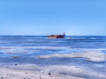 Scenic view of sea against clear sky