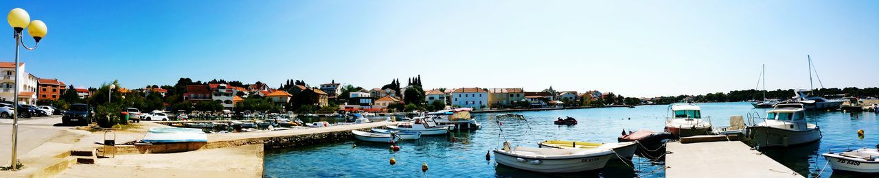 Boats moored in canal