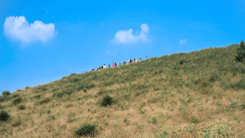 Scenic view of mountains against blue sky