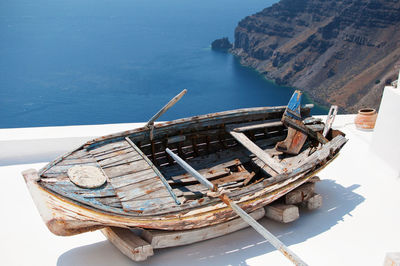 High angle view of boat moored on sea against sky