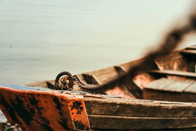 Close-up of rusty chain on beach