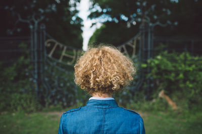 Rear view of woman on field