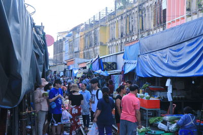 People on street market in city