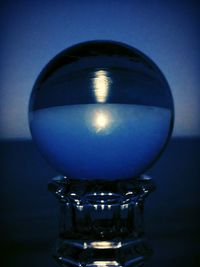 Close-up of illuminated lamp against dark background