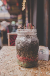 Close-up of glass of jar on table