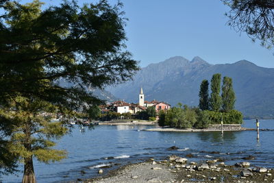 Scenic view of temple by mountains against clear sky