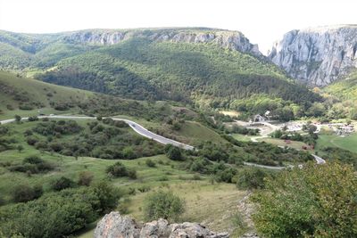 High angle view of road amidst trees and mountains