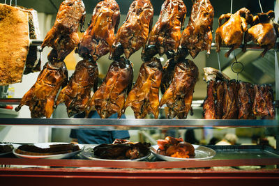 Close-up of roasted meat for sale at shop