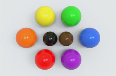 Close-up of multi colored candies against white background